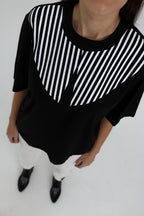 "BALTI BRŪKŠNELIAI", JUODI MARŠKINĖLIAI